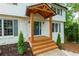 A beautiful wooden front porch leads to the door of this home at 280 E Valley Dr, Marietta, GA 30068