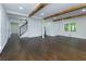Bright living room with hardwood floors, exposed wood beams, and easy access to the staircase at 280 E Valley Dr, Marietta, GA 30068