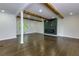 Inviting living room featuring hardwood floors, exposed wood beams and a modern fireplace at 280 E Valley Dr, Marietta, GA 30068