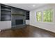 The living room features a brick fireplace, built-in bookshelves, and a window at 280 E Valley Dr, Marietta, GA 30068