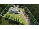 Beautiful home from an aerial view, displaying the long driveway and a meticulously maintained lawn at 380 Russell Rd, Lawrenceville, GA 30043