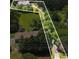 Aerial view of property highlighting the home's setting amidst lush greenery and mature trees at 380 Russell Rd, Lawrenceville, GA 30043