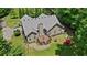 Spacious backyard featuring a wooden deck, stone patio, and ample greenery for outdoor entertaining and relaxation at 380 Russell Rd, Lawrenceville, GA 30043