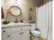 Bathroom featuring a single vanity with granite countertops and a shower and tub combination at 380 Russell Rd, Lawrenceville, GA 30043