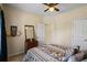Bright bedroom featuring carpeting, a ceiling fan, and lots of natural light at 380 Russell Rd, Lawrenceville, GA 30043