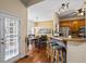 Dining area with a breakfast bar and oak cabinets with hardwood floors at 380 Russell Rd, Lawrenceville, GA 30043