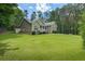 Charming one-story home with a well-manicured lawn, inviting front porch, and lush landscaping at 380 Russell Rd, Lawrenceville, GA 30043
