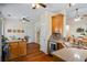 Cozy kitchen with oak cabinets, granite countertops, and stainless steel appliances at 380 Russell Rd, Lawrenceville, GA 30043