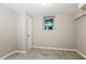 Cozy bedroom with neutral paint, plush carpeting, and a window for natural light at 6480 Port A Prince Drive Dr, Forest Park, GA 30297