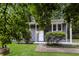 Charming single-story home with gray siding, white trim, and a well-manicured lawn at 6480 Port A Prince Drive Dr, Forest Park, GA 30297