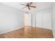 Spacious bedroom boasts hardwood floors, a ceiling fan, and a closet with bi-fold doors at 1445 Monroe Ne Dr # F10, Atlanta, GA 30324