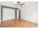 Bright bedroom with hardwood floors, double closet, and neutral paint, offering a cozy retreat at 1445 Monroe Ne Dr # F10, Atlanta, GA 30324
