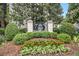 A community entrance sign surrounded by greenery and flowers at 1445 Monroe Ne Dr # F10, Atlanta, GA 30324