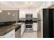 Bright kitchen featuring stainless appliances, granite countertops and backsplash, and recessed lighting at 1445 Monroe Ne Dr # F10, Atlanta, GA 30324