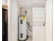 Cozy laundry room includes stacked washer and dryer, and a water heater for convenience at 1445 Monroe Ne Dr # F10, Atlanta, GA 30324