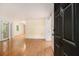 Open layout with hardwood floors leads to double doors for indoor/outdoor living at 1445 Monroe Ne Dr # F10, Atlanta, GA 30324