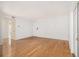 Spacious living room with hardwood floors and white walls providing a bright and inviting atmosphere at 1445 Monroe Ne Dr # F10, Atlanta, GA 30324