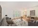 Comfortable living room with hardwood floors, neutral colors, and access to the outdoors at 1445 Monroe Ne Dr # F10, Atlanta, GA 30324