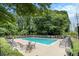 Community pool offers a relaxing space to unwind with ample seating at 1445 Monroe Ne Dr # F10, Atlanta, GA 30324