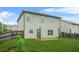 Backyard with a concrete patio, green grass and wood fence at 2166 Villa Spring Ct, Dacula, GA 30019