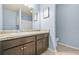 Bathroom with a single sink vanity, tile floor, and an oval toilet at 2166 Villa Spring Ct, Dacula, GA 30019