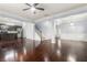Open-concept living area with hardwood floors, staircase, and seamless flow into the kitchen at 2166 Villa Spring Ct, Dacula, GA 30019