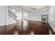 Spacious living room with hardwood floors, fireplace, staircase, and natural light at 2166 Villa Spring Ct, Dacula, GA 30019