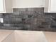 Close-up of a kitchen backsplash, showing the tiling and countertop details at 3102 Marbella Cir # 1, Kennesaw, GA 30152