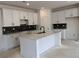 Contemporary kitchen featuring white cabinets, an island with marble countertop, and elegant backsplash tiles at 3102 Marbella Cir # 1, Kennesaw, GA 30152