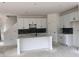 Bright kitchen with an island, stone countertops, subway tile backsplash, and white cabinets at 3102 Marbella Cir # 1, Kennesaw, GA 30152