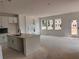 Open concept living space with white walls, light colored floors, and a view from the kitchen island at 3102 Marbella Cir # 1, Kennesaw, GA 30152