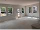 Bright living room with many windows and a glass door to the outside at 3102 Marbella Cir # 1, Kennesaw, GA 30152