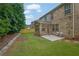 Well-maintained backyard with a lush lawn, brick patio, and privacy fence, great for outdoor enjoyment at 7027 Walham Grv, Duluth, GA 30097