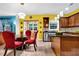 A kitchen and dining area with an island, stainless steel appliances, and granite countertops at 7027 Walham Grv, Duluth, GA 30097