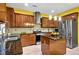 This kitchen features an island, stainless steel appliances, and granite countertops at 7027 Walham Grv, Duluth, GA 30097