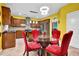 Well-lit eat-in kitchen, features stainless appliances, stylish lighting and granite countertops at 7027 Walham Grv, Duluth, GA 30097