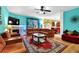 The living room features a fireplace and large windows with custom draperies at 7027 Walham Grv, Duluth, GA 30097