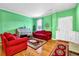 Bright living room with hardwood floors, colorful walls, and ample seating at 7027 Walham Grv, Duluth, GA 30097