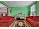 Inviting living room featuring hardwood floors, bright walls, and comfortable sofas at 7027 Walham Grv, Duluth, GA 30097