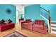 The living room with hardwood floors leads to a staircase to the upper level at 7027 Walham Grv, Duluth, GA 30097