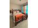 Bedroom with wrought iron frame bed and colorful curtains at 2080 Belmont Cir, Conyers, GA 30012