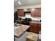 Kitchen with cabinets, range, island with sink, and countertop space at 2080 Belmont Cir, Conyers, GA 30012