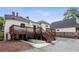 Expansive backyard featuring a spacious deck, basement entrance, and ample parking at 27 Sessions Nw St, Marietta, GA 30060