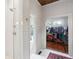 Bathroom with a walk-in shower and a doorway to a closet with lots of storage at 27 Sessions Nw St, Marietta, GA 30060