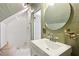 Bathroom boasts a vintage sink, a walk-in shower, and light green colored walls at 27 Sessions Nw St, Marietta, GA 30060