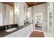 Bathroom featuring a long double vanity, a walk-in shower and an open view to a bedroom at 27 Sessions Nw St, Marietta, GA 30060