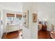 View of bedroom with shiplap walls, natural light from windows, and beautiful wood floors at 27 Sessions Nw St, Marietta, GA 30060