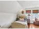 Bright bedroom featuring shiplap ceiling, natural light, and hardwood floors at 27 Sessions Nw St, Marietta, GA 30060