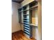 Custom closet features adjustable shelves and clothing rods to suit any homeowner's storage needs at 27 Sessions Nw St, Marietta, GA 30060