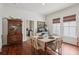 Elegant dining room with hardwood floors, ample lighting, and stylish decor at 27 Sessions Nw St, Marietta, GA 30060